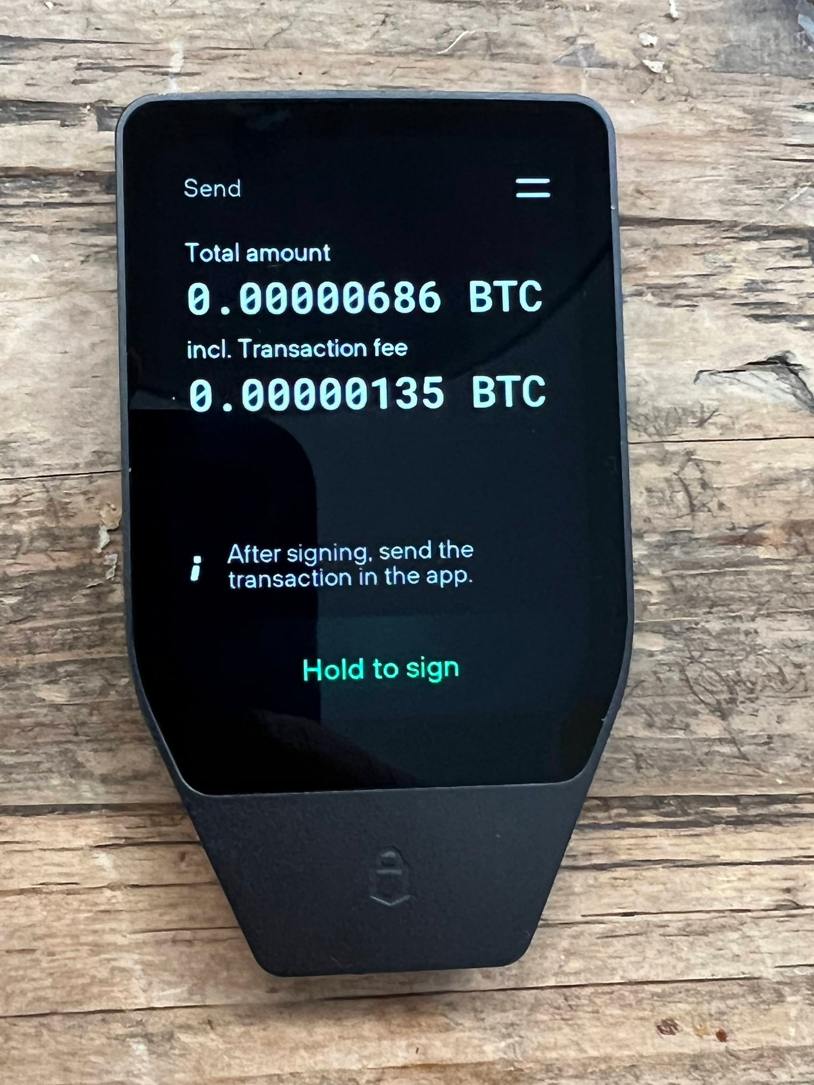 Trezor Safe 7 hardware wallet with a 2.5-inch high-resolution color touchscreen and aluminum body.